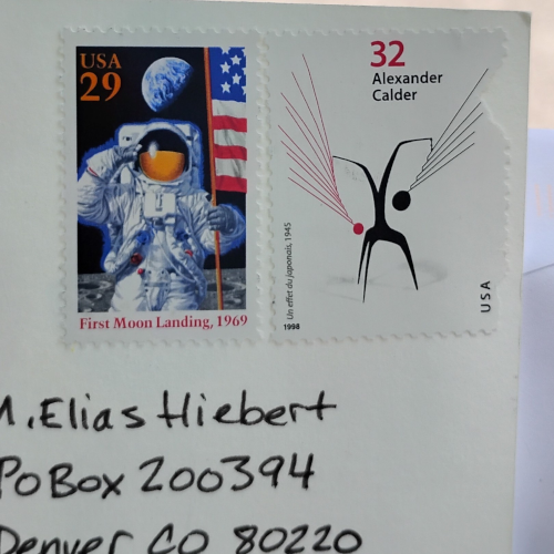 A 29 cent stamp commemorating the moon landing and a 32 cent stamp celebrating artist Alexander Calder. 
